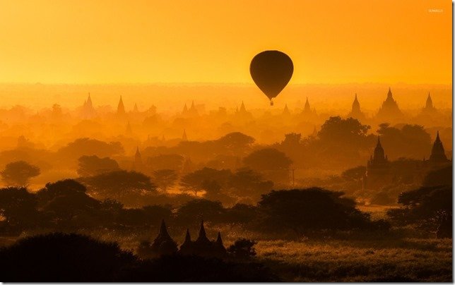 flying-a-hot-air-balloon-at-sunset-46598-1920x1200